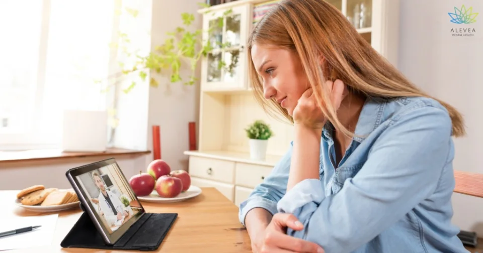 Adult attending a psychiatric telehealth evaluation from home